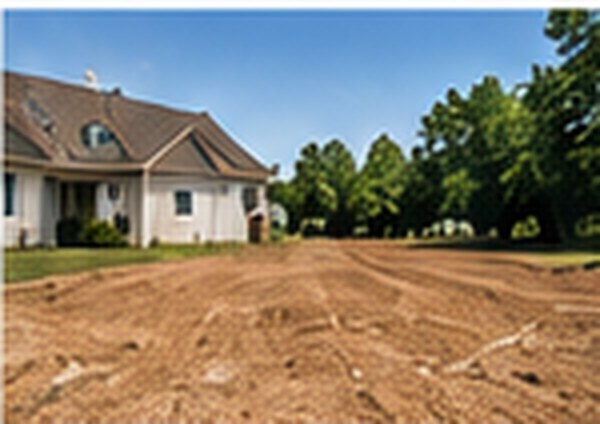 Prepared building pad next to a house